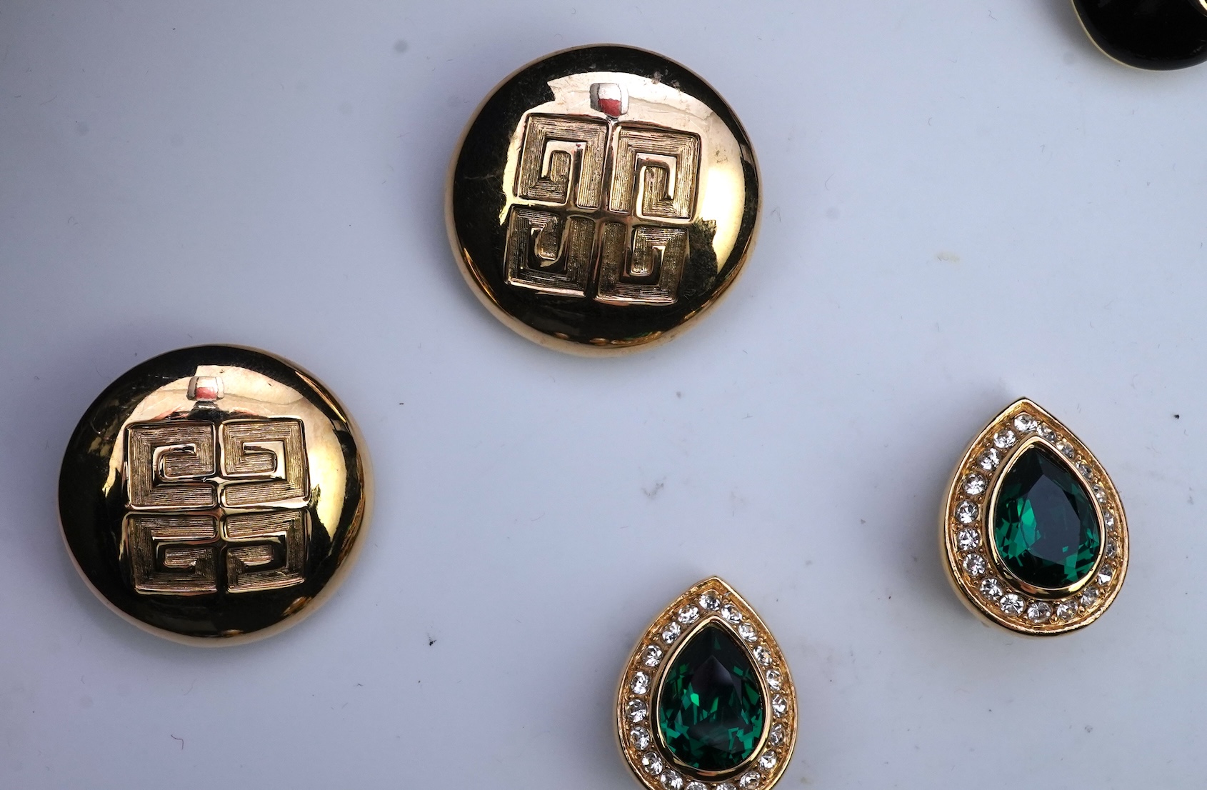 Two pairs of Givenchy clip earrings and four other pairs.